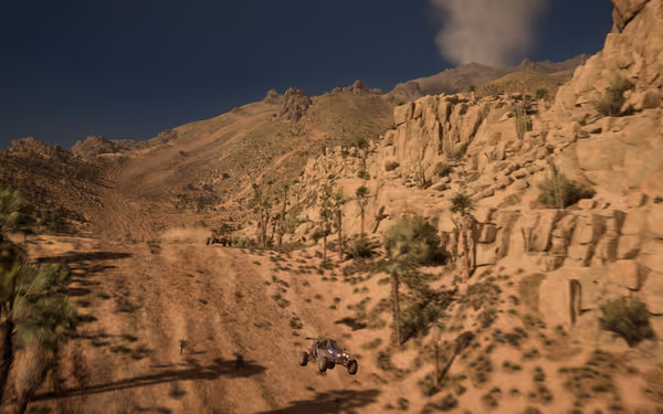 Two off-road buggies driving through a rocky desert landscape with mountains.