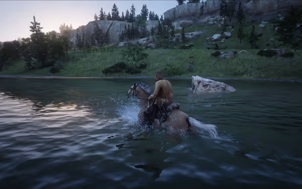A rider crosses a calm river on horseback, surrounded by lush greenery and rocky cliffs.