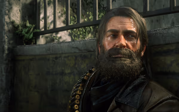 A character with long hair and a beard leans against a stone wall, sunlight filtering through a nearby metal railing, with ferns sprouting from the cracks.