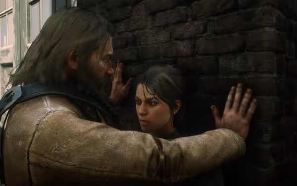 A male character places his hands on a brick wall, standing in front of a female character at the corner of a building.