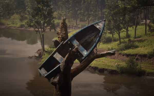 A weathered boat sits atop a broken tree trunk by a calm river, surrounded by lush greenery in daylight.
