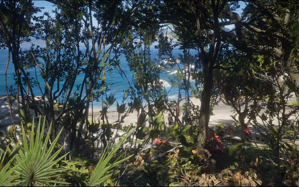 A glimpse of a serene beach through lush tropical vegetation.