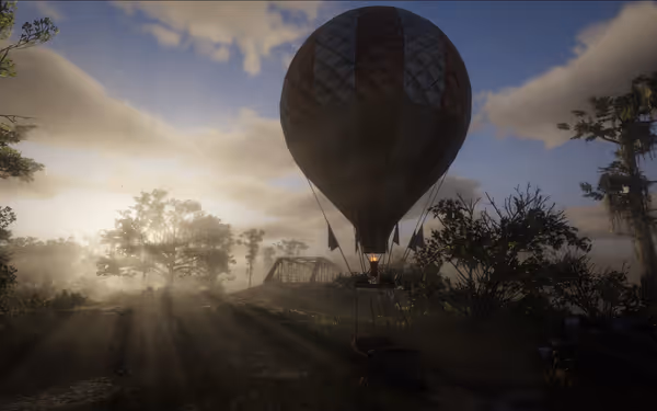 Hot air balloon over grassy field, trees, bridge, sunlight through clouds.