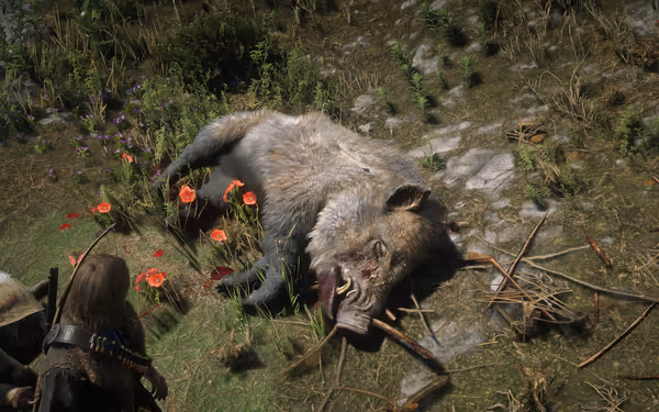 A dead boar lies on the ground, surrounded by flowers and blood, with a person nearby.
