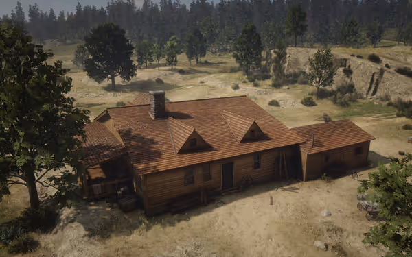 A wooden house with a chimney surrounded by trees and open grassy fields.