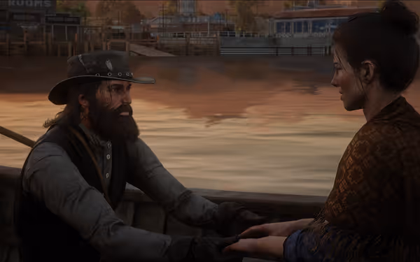 A bearded man and a woman sit in a wooden boat, holding hands.
