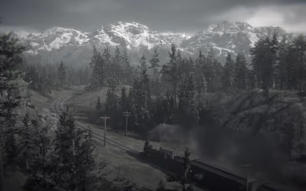 A train emits smoke while traveling through dense forests with snowy mountains behind.