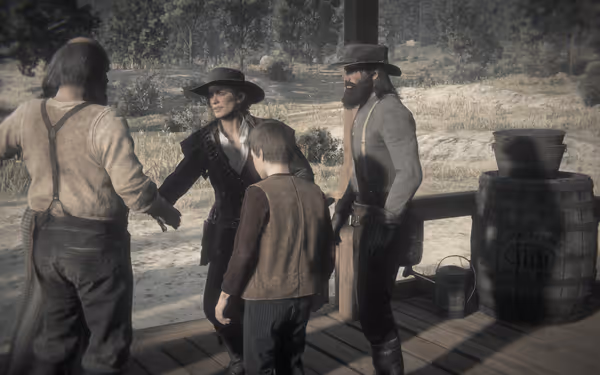 A group of people stands on a wooden porch in a rural setting.