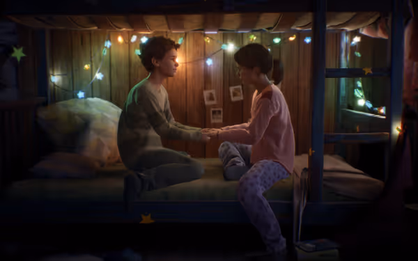 Two young children grasping hands, sitting on a bunk bed lit by colourful fairy lights
