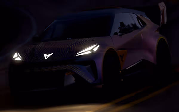 A polychromatic purple car accented with yellow dots in the dark, headlights and logo shining bright in the night