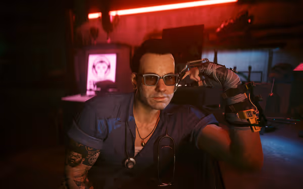 A cybernetic doctor with glasses and tattoos leans on a table in dim lighting.