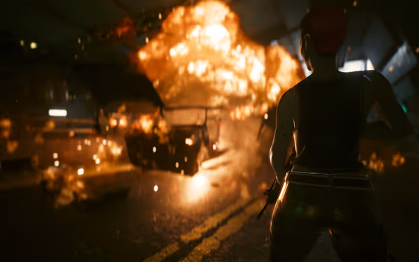 A person with a weapon watches a burning car explode in a dark tunnel