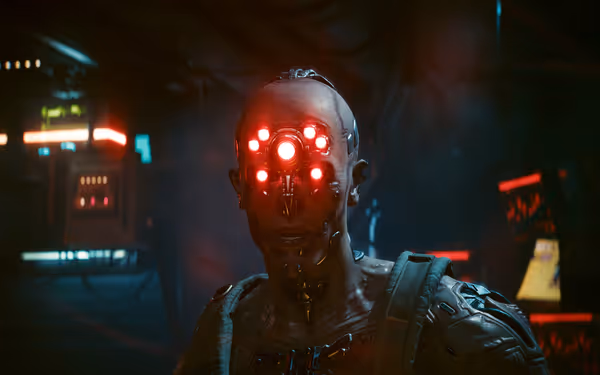 A cybernetic figure with glowing red eyes and metallic implants stands in a dim room