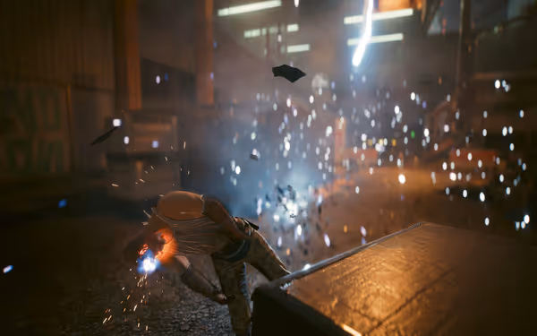 A man in a tank top is hit by a bright explosion, sparks flying around