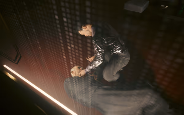 A man in a shiny jacket kneels over an older man, grabbing his throat