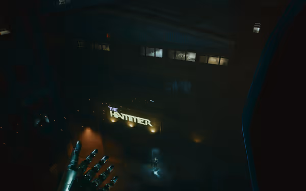 A robotic hand reaches toward a neon-lit building as a lone figure stands below