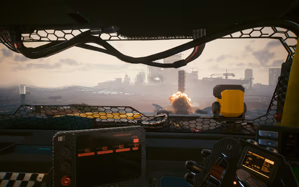 A vehicle's reinforced windshield frames a missile launch explosion in a futuristic wasteland.