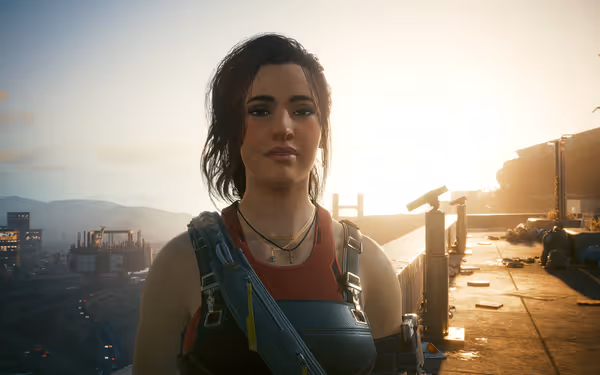 A woman with dark hair and overalls stands confidently against a sunset-lit cityscape.