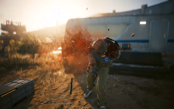 A man in tactical gear is shot in the head, blood spraying mid-impact violently.