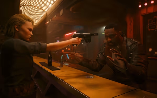 A woman points a pistol at a man with raised hands inside a dim bar.
