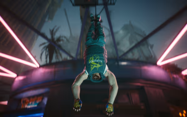 Muscular beheaded man hangs upside down by his feet in neon-lit urban environment.