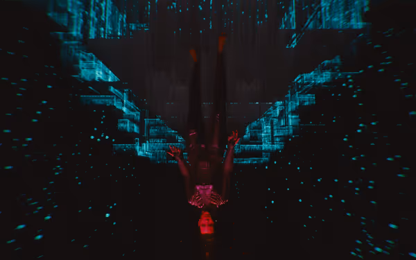 A red-lit figure hangs upside down in a glowing blue digital grid environment.