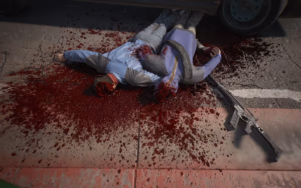 Two headless bodies lie in a blood pool beside a rifle near a curb.