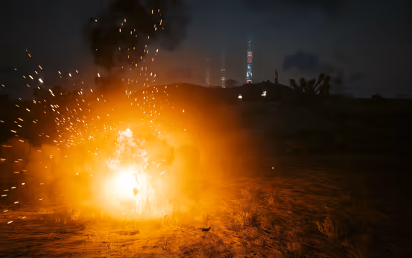 A large fiery explosion lights up a dark desert with a futuristic city in background.