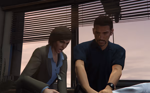 A woman in a blazer and a man in dark shirt lean over a patient together.
