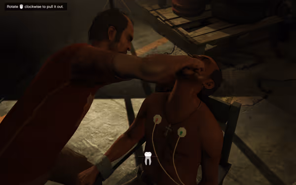 A man pulls another man's tooth while he sits restrained with medical pads on chest.