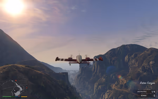 A small red and white airplane flies above a canyon between tall mountains under the sun.