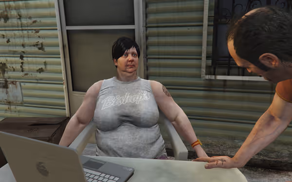 A woman in a sleeveless Bishop's shirt talks to a man beside a laptop outside.