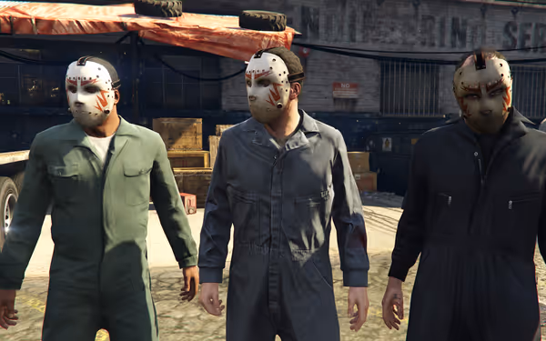 Three people wearing coveralls and white masks stand outside in a workyard in daylight.