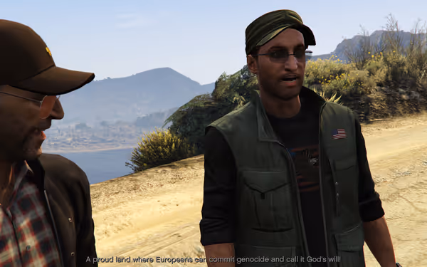Two men stand by a dirt road with hills behind, one in a cap and vest.