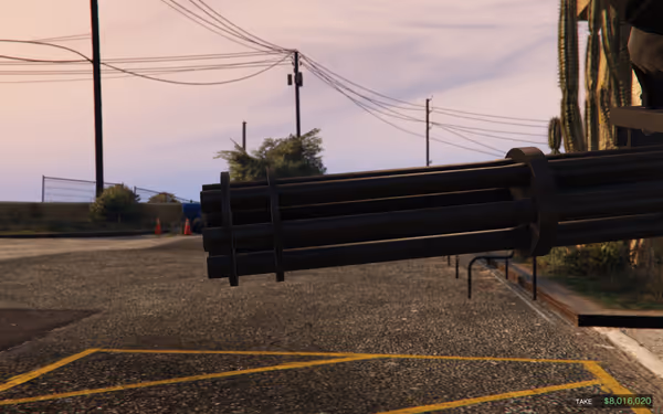 A large weapon barrel with power lines and a cactus in the background.