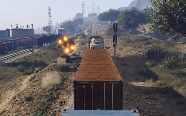A truck drives near train tracks while an explosion occurs beside the road.