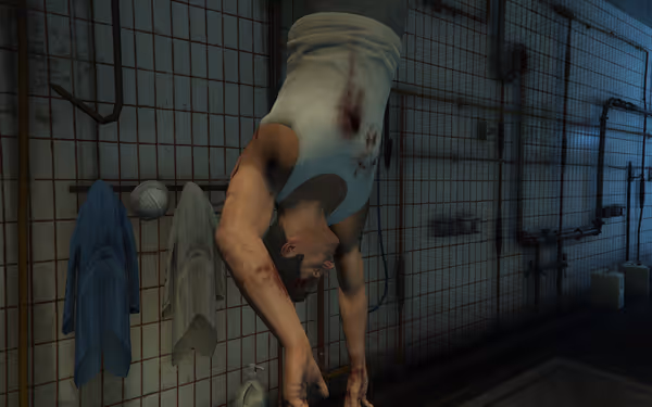A bloodied man in a white tank top hangs upside down in a tiled, industrial room.