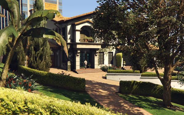 Large villa-style house with lush landscaping and a person entering the front door.