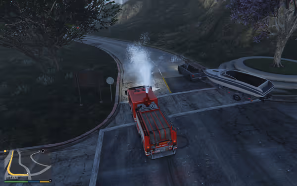 A red fire truck sprays water on a road near a truck towing a boat.