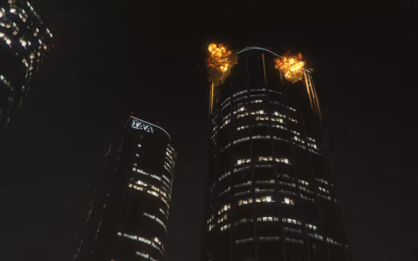 Two tall office buildings at night, with explosions and fire at the top floors.