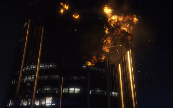 A tall building at night is engulfed in explosions and rising smoke.