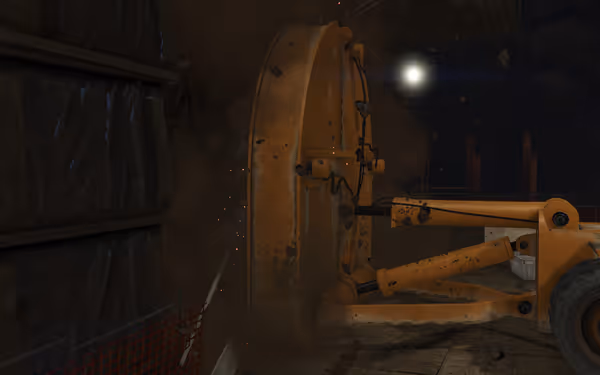 A large yellow tunnel boring machine drills into rock, sending dust and debris flying.