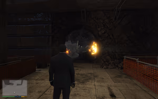 A man in a suit stands outside a tunnel entrance as explosions and fire erupt inside.