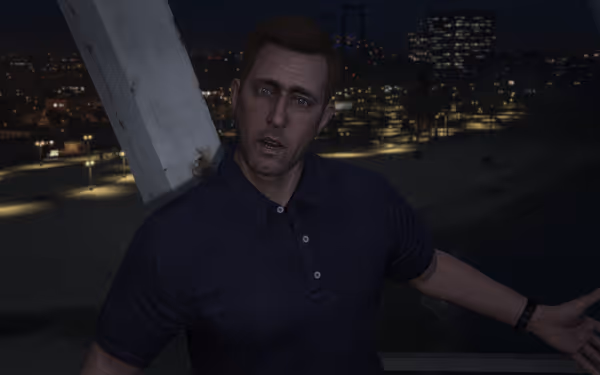 A man in a dark polo shirt stands on a balcony at night overlooking city lights.