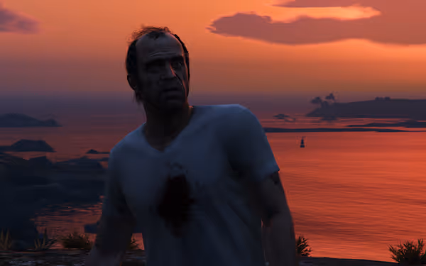 Man in bloody white shirt stands near cliff edge at sunset with orange sky.