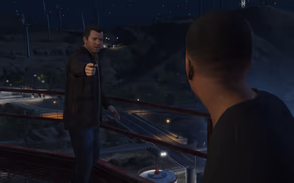 A man in a black jacket points a handgun at another man at night.