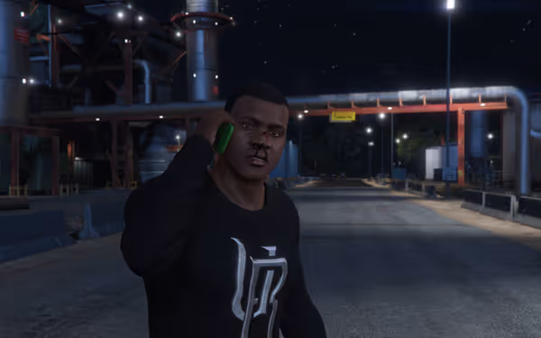 A man with a bloody nose talks on a phone at night.