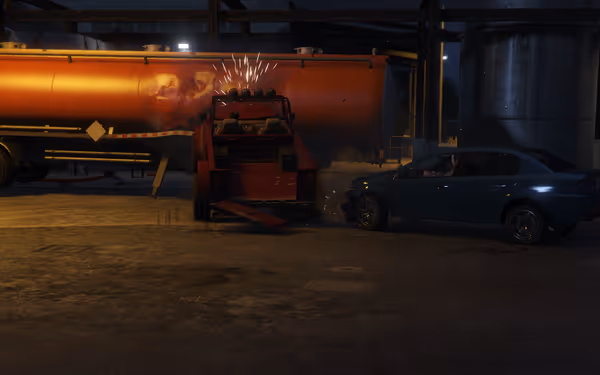 A blue car has collided with a red tow truck near an orange tanker.