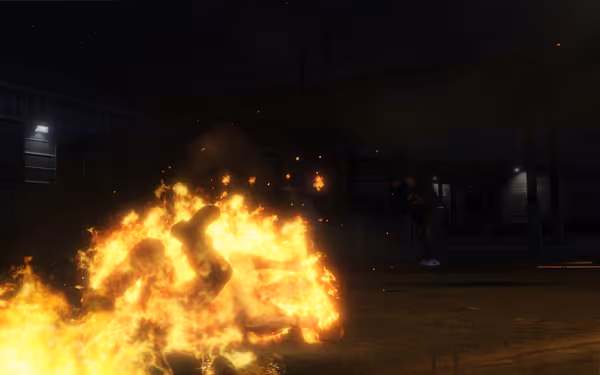 A person is engulfed in flames while another figure stands in the background.