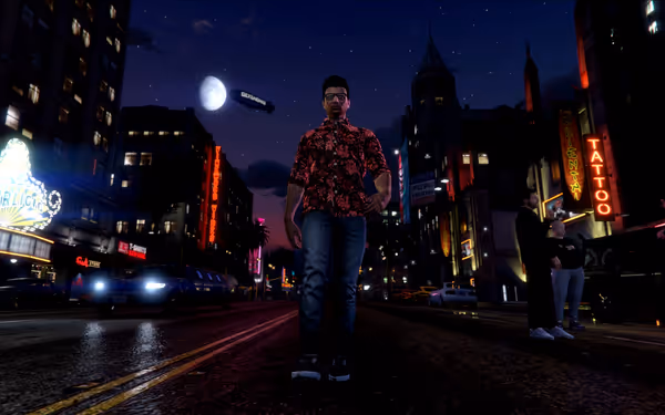 A man in a floral shirt walks down a neon-lit city street at night.